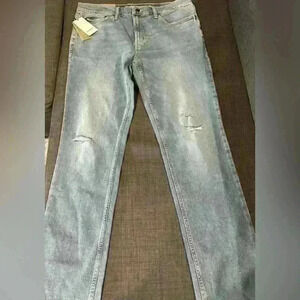 Men’s jeans slightly distressed knee cutouts by Goodfellow& Co. size 36x32. NWT